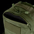 Close-up of the Condor Venture Backpack 27.5L in olive green, featuring a partially unzipped front pocket that reveals the interior lining.